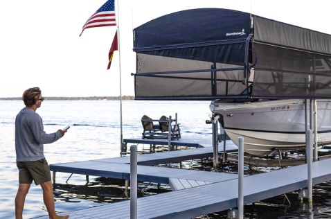 Wireless remote controlling ShoreScreen Power Curtain for raising and lowering screens